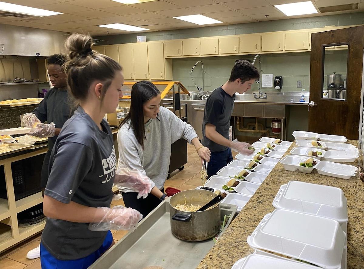 Students preparing meals at student-led soup kitchen